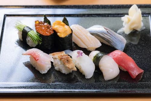 Conveyor belt sushi plates at a Japanese Kaiten-Zushi restaurant
